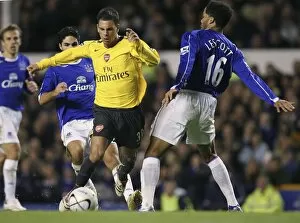 Evertons Lescott challenges Arsenals Aliadiere for the ball during their English League Cup fourth