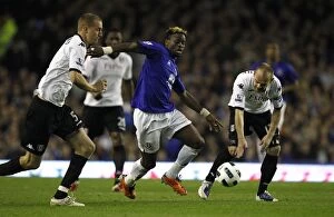 Images Dated 19th March 2011: Everton's Louis Saha Faces Off Against Fulham's Brede Hangeland