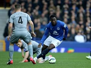 Images Dated 15th March 2015: Everton's Lukaku Outmaneuvers Newcastle's Defenders: A Dazzling Moment at Goodison Park