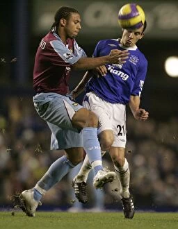 Everton v West Ham United Collection: Evertons Osman challenges West Ham Uniteds Ferdinand for the ball during their English Premier Lea