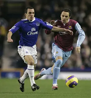 Framed Print : Evertons Osman challenges West Ham Uniteds Etherington for the ball during their English Premier L Framed Print : Evertons Osman challenges West Ham Uniteds Etherington for the ball during their English Premier L