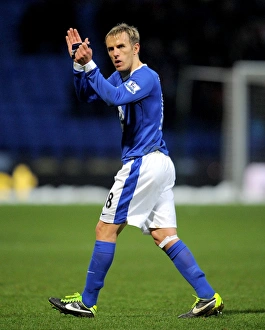 Everton's Phil Neville Celebrates FA Cup Victory Over Bolton Wanderers at Reebok Stadium (January 26, 2013): A Triumphant Applause to the Faithful Fans