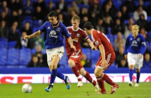 21 September 2011, Carling Cup Round 3 Everton V West Bromwich Albion Prints: Everton's Stracqualursi Slips Past West Brom Defenders in Carling Cup Showdown