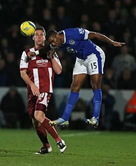 Images Dated 7th January 2013: Everton's Sylvain Distin Clears the Ball in FA Cup Third Round Match against Cheltenham Town