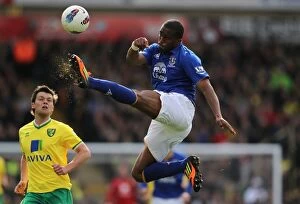 Images Dated 7th April 2012: Everton's Sylvain Distin Saves the Day: Clearing the Ball Against Norwich City (April 2012)