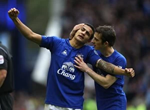 Images Dated 17th October 2010: Everton's Tim Cahill and Leighton Baines: Unforgettable Goal Celebration Against Liverpool at