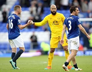 Everton v Aston Villa - Goodison Park Collection: Everton's Tim Howard and James McCarthy: Celebrating a Hard-Fought Premier League Victory Over