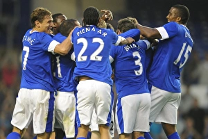 Everton's Tony Hibbert Celebrates Euphoric Goal Surrounded by Jubilant Team Mates (Everton vs AEK Athens, Pre-Season Friendly, Goodison Park)