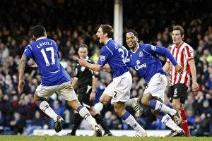 Everton's Triumph: Gosling, Lescott, and Cahill's Celebration of the Third Goal vs. Sunderland (December 28, 2008)