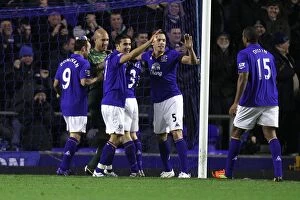 Images Dated 4th January 2012: Everton's Unforgettable Goal: Tim Howard's Strike and the Ensuing Celebration