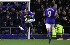 Images Dated 4th January 2012: Everton's Unforgettable Goalkeeper Goal: Tim Howard Scores, Players Celebrate in Euphoria at