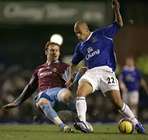 Framed Print : Evertons Vaughan challenges West Ham Uniteds Collins for the ball during their English Premier Lea Framed Print : Evertons Vaughan challenges West Ham Uniteds Collins for the ball during their English Premier Lea