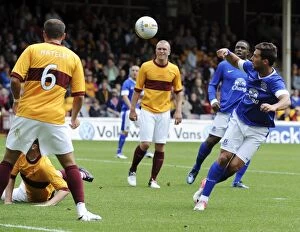Images Dated 21st July 2012: Everton's Vellios Aiming for the Net: Pre-Season Clash vs Motherwell at Fir Park Stadium