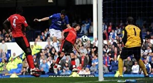 Images Dated 16th April 2011: Everton's Vellios Goes for Glory: Thrilling Headed Attempt vs