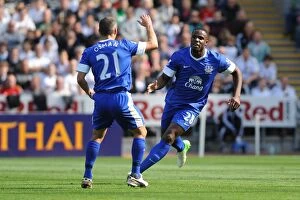 Images Dated 22nd September 2012: Everton's Victor Anichebe and Leon Osman Celebrate Goal Against Swansea City