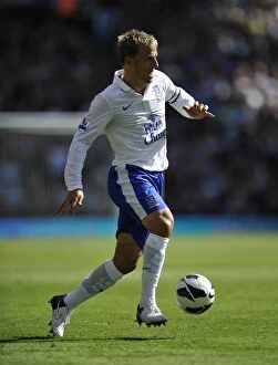 Images Dated 25th August 2012: Everton's Victory: Phil Neville Leads the Toffees to a 3-1 Win Over Aston Villa (25-08-2012)