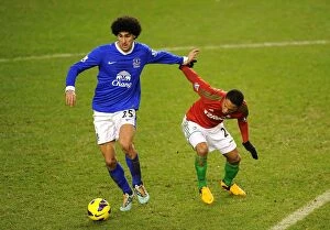 Images Dated 12th January 2013: Fellaini vs. de Guzman: A Battle for Midfield Supremacy - Everton vs. Swansea City