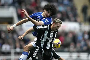 Framed Print : Fellaini vs. Lovenkrands: Intense Rivalry in Premier League Football - Newcastle United vs. Everton Framed Print : Fellaini vs. Lovenkrands: Intense Rivalry in Premier League Football - Newcastle United vs. Everton