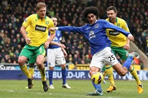 Images Dated 23rd February 2013: Fellaini's Determined Shot: Norwich City vs. Everton, Premier League (Feb 2013)