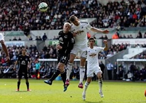 Swansea City v Everton - Liberty Stadium Collection: Fernandez vs. Naismith: A Battle of Determination in the Everton vs
