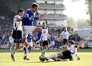 Images Dated 4th November 2006: Fulham v Everton - 4 / 11 / 06 Franck Quedrue of Fulham slides in to tackle Evertons Phil Neville