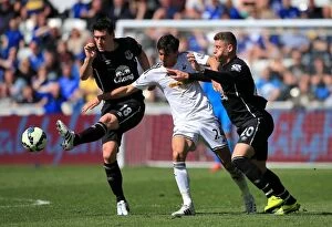 Images Dated 11th April 2015: Gareth Barry vs Jack Cork: A Battle of Midfield Masters in Everton vs Swansea City