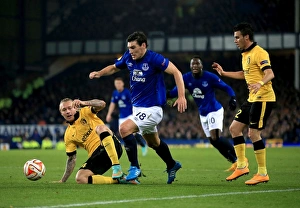 Framed Print : Gareth Barry vs. Simon Kjaer: A Battle for the Ball in Everton vs. Lille UEFA Europa League Clash Framed Print : Gareth Barry vs. Simon Kjaer: A Battle for the Ball in Everton vs. Lille UEFA Europa League Clash