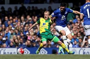 Everton v Norwich City - Goodison Park Collection: Gareth Barry vs. Steven Naismith: Intense Tackle at Goodison Park - Everton vs