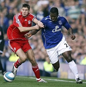 Images Dated 20th October 2007: Gerrard vs Yakubu: A Football Rivalry Unfolds - Everton vs Liverpool at Goodison Park (2007)