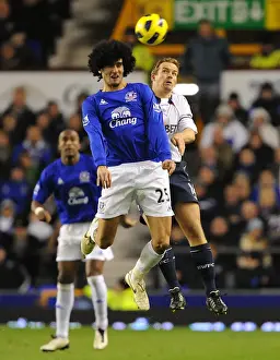 Marouane Fellaini Prints: Head-to-Head at Goodison Park: A Battle of Aerial Supremacy between Fellaini and Davies (Everton vs)