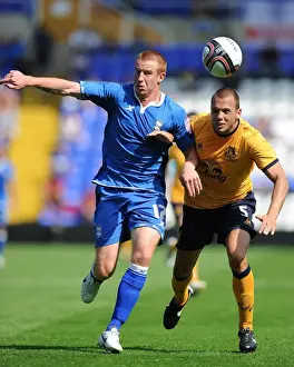 Heitinga vs Rooney: A Tense Showdown in Everton's Pre-Season Clash with Birmingham City (30 July 2011)
