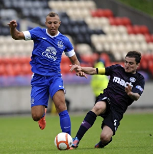 Season 2012-13 Prints: Hope vs Paton: A Fierce Rivalry Unfolds in Everton's Pre-Season Clash against Partick Thistle