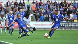 Images Dated 19th September 2015: Intense Battle for Ball: Jagielka, Browning vs. Gomis - Everton vs. Swansea Premier League Clash