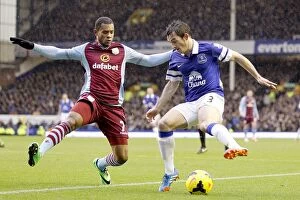 Images Dated 1st February 2014: Intense Battle for Ball Possession: Baines vs. Bacuna - Everton vs