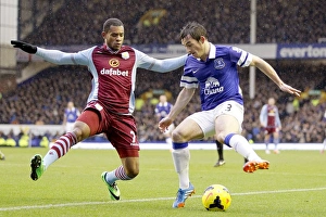 Everton 2 V Aston Villa 1 : Goodison Park : 01-02-2014 Prints: Intense Battle for Ball Possession: Baines vs