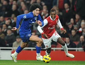 01 February 2011 Arsenal v Everton Collection: Intense Battle for Ball Possession: Fellaini vs. Djourou - Arsenal vs