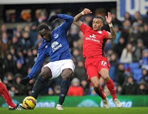 Everton v Leicester City - Goodison Park Collection: Intense Battle for Ball Possession: Lukaku vs. Simpson at Goodison Park