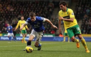 Images Dated 23rd February 2013: Intense Battle for Ball Possession: Seamus Coleman vs. Javier Garrido - Norwich City vs