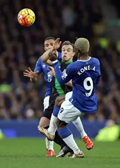 Everton V Stoke City - Goodison Park Prints: Intense Battle at Goodison Park: Arouna Kone vs Xherdan Shaqiri