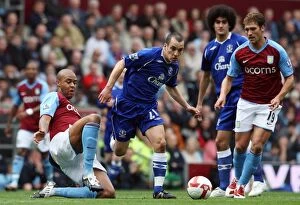 Images Dated 12th April 2009: Intense Battle: Osman vs. Knight in Aston Villa vs. Everton Premier League Clash