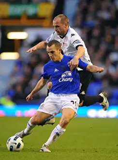 19 March 2011 Everton V Fulham Prints: Intense Battle: Osman vs Murphy at Goodison Park - Everton vs Fulham