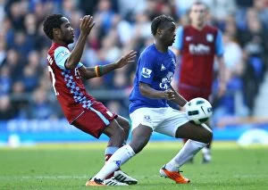 Images Dated 2nd April 2011: Intense Battle for Possession: Magaye Gueye vs Jean Makoun (Everton vs Aston Villa)