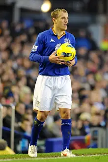 Barclays Premier League Prints: Intense Clash: Everton vs Blackburn Rovers - Phil Neville at Goodison Park (Barclays Premier League)