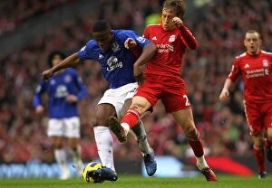 Images Dated 16th January 2011: Intense Rivalry: Anichebe vs. Lucas at Anfield - Liverpool vs
