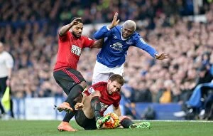 Images Dated 13th February 2016: Intense Rivalry: Arouna Kone vs. Craig Dawson's Battle for the Ball at Goodison Park