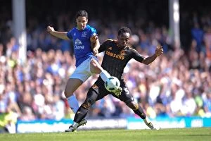 Images Dated 22nd May 2011: Intense Rivalry: Arteta vs. Essien at Goodison Park - Everton vs