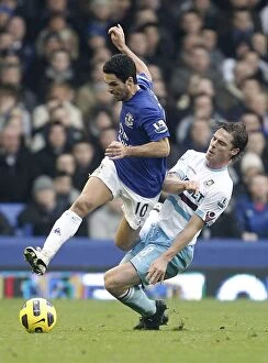 Images Dated 24th January 2011: Intense Rivalry: Arteta vs. Parker - A Battle for Ball Possession (Everton vs)