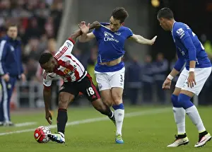Intense Rivalry: Baines vs Defoe Battle for Ball - Sunderland vs Everton, Premier League