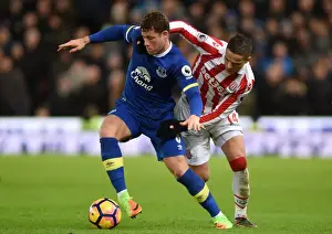 Intense Rivalry: Barkley vs. Afellay - A Battle for Ball Possession, Everton vs. Stoke City, Premier League