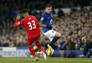 Images Dated 7th February 2015: Intense Rivalry: Besic vs Ibe - The Battle for the Ball at Goodison Park